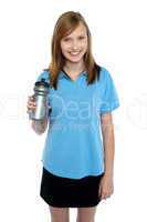 Teen in sports wear posing with a water bottle