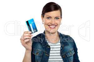Shopaholic woman showing cash card