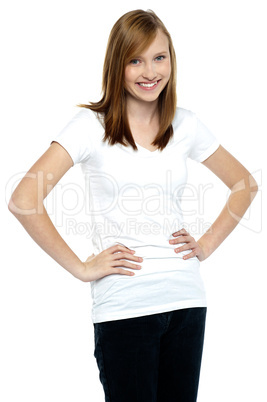 Attractive teenager posing casually, hands on waist