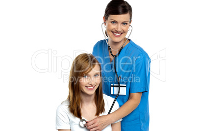Young patient being examined by a cheerful doctor