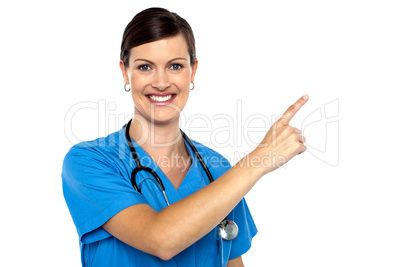 Doctor pointing away with her index finger