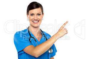 Doctor pointing away with her index finger