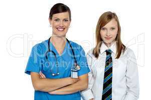 Confident medical expert posing with school girl