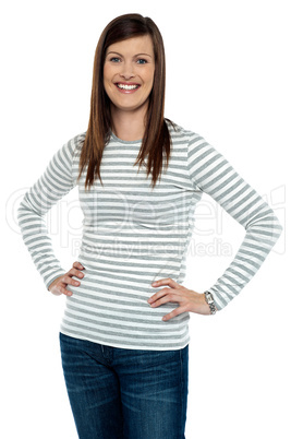 Trendy woman posing with hands on her waist