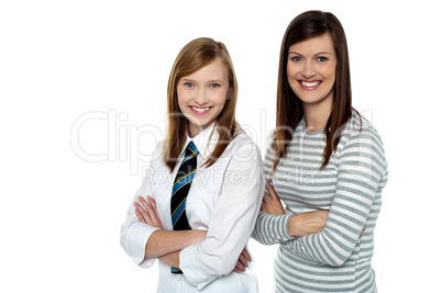 Beautiful mom and daughter posing with confidence