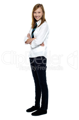 Confident high school girl posing with folded arms