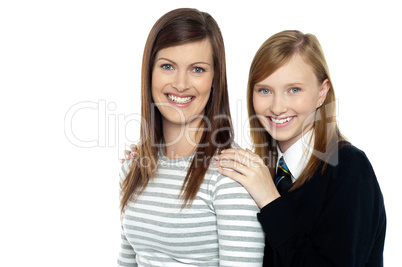 Daughter resting hands on mothers shoulders