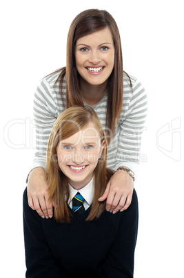 Cheerful duo of adorable mother and daughter