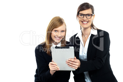Tutor with student holding portable tablet pc
