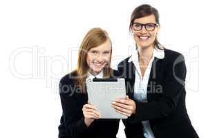 Tutor with student holding portable tablet pc