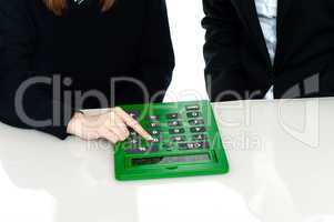 Cropped image of teacher and a student operating calculator