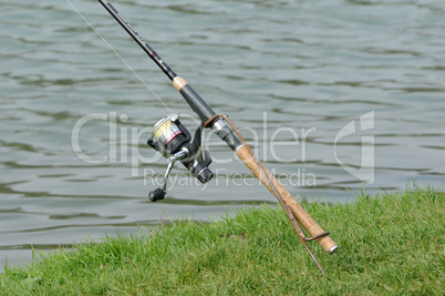 France, a fishing rod by a pond
