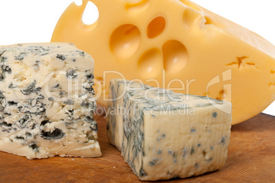 Dorblu and other cheeses on wooden board