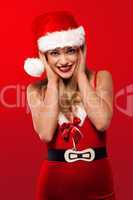 Joyful woman in a Santa Christmas outfit