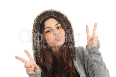 Teen girl with the fingers in victory sign