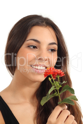 Teen girl smelling a flower