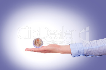 Outstretched hand with euro coin