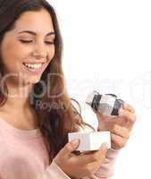 Teen girl smiling openning a gift box