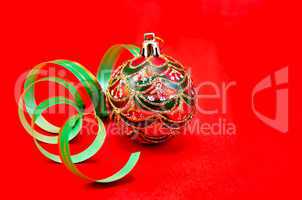 Christmas red ball with green ribbon