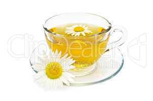 Herbal tea in a glass cup with daisies