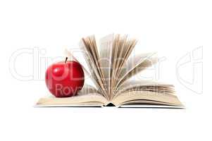 red apple on a book