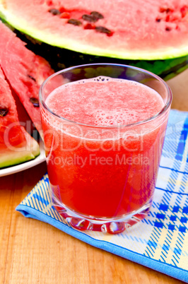 Juice watermelon on a napkin and a board