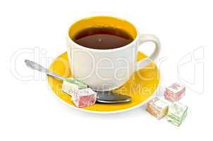 Tea in yellow cup with lokum