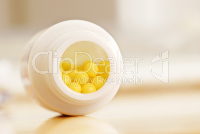 Yellow dragee pills