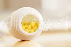 Yellow dragee pills