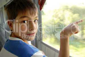 Boy portrait by train window