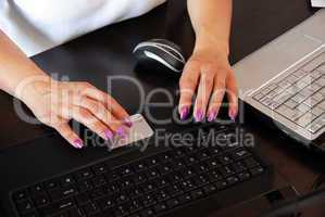 Female hands on keyboard