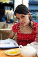 Teenage girl in street cafe