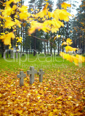 Three tombstone crosses.