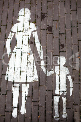 Road sign mother and a child