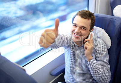 Young successful businessman in the train.
