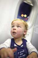 Young passenger in the plane.
