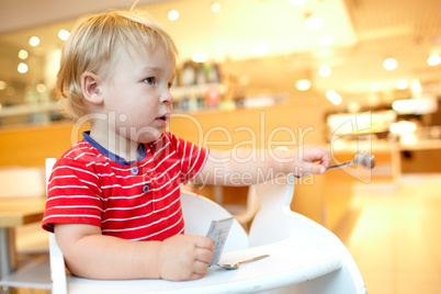 Little boy in the restaurant.