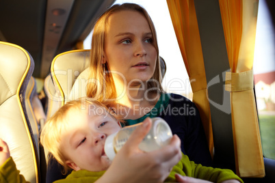 Mother with kid in the bus.