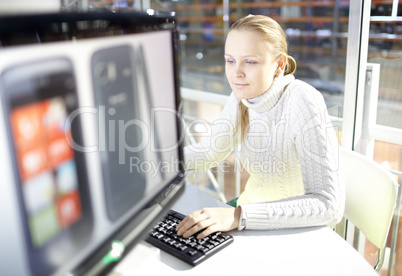 Young girl is choosing the smart phone.