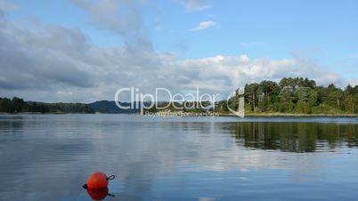 Water and lake with islands and clouds