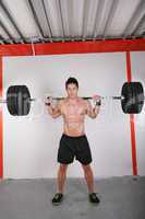 Man with dumbbell weight training equipment on sport gym
