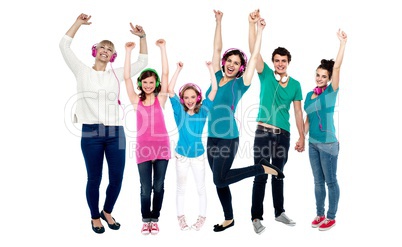 Group of music lovers dancing with their headphones on