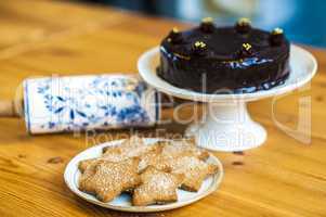 Rich chocolate cake and star shaped cookies