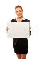 Positive business woman holding white board