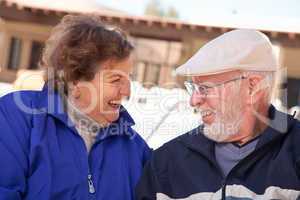 Happy Senior Adult Couple Bundled Up Outdoors