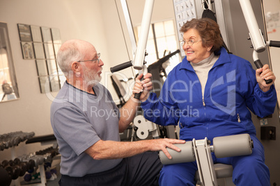 Senior Adult Couple Working Out Together in the Gym