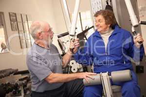 Senior Adult Couple Working Out Together in the Gym