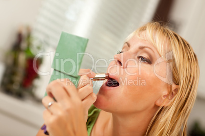 Blonde Woman Applying Her Makeup