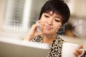 Pretty Smiling Mixed Race Woman Using Laptop
