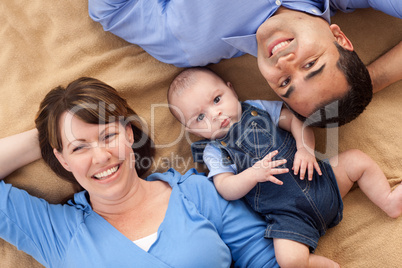 Mixed Race Family Playing on the Blanket